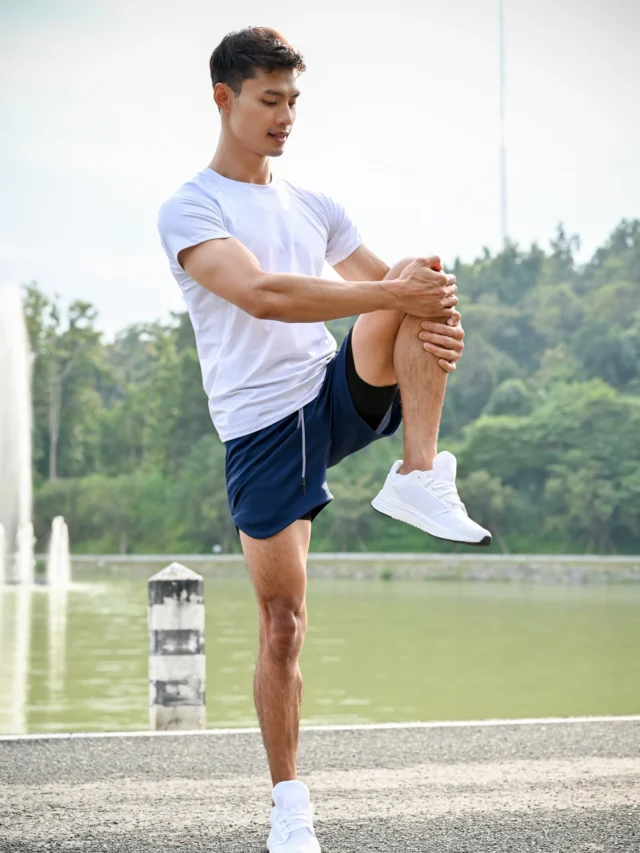 active-asian-athletic-man-stretching-his-leg-muscle-warm-up-before-workout