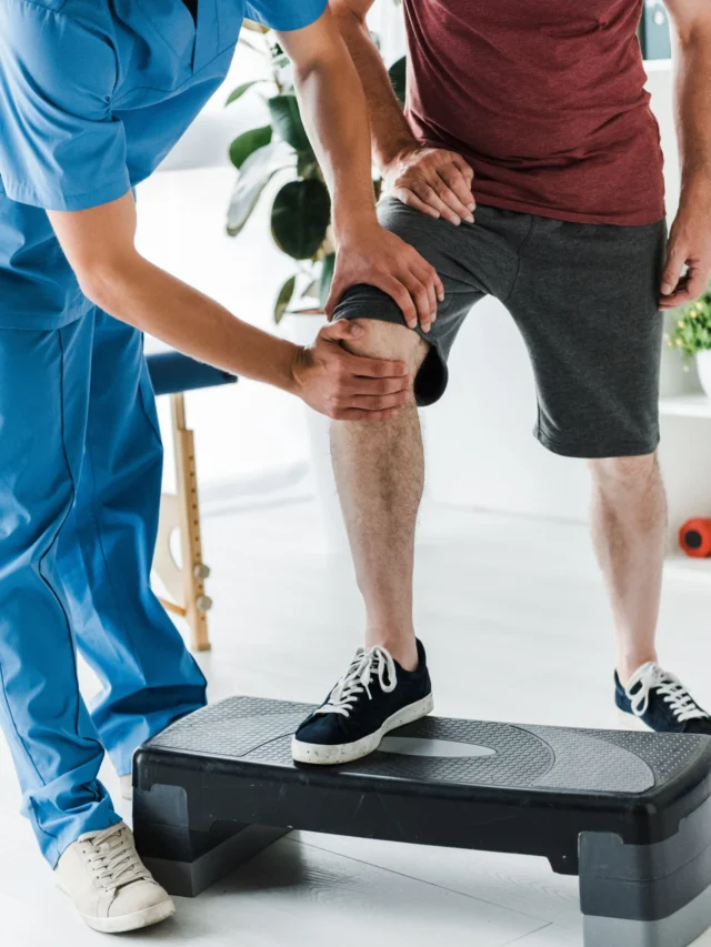 cropped-view-doctor-touching-knee-mature-patient-step-platform