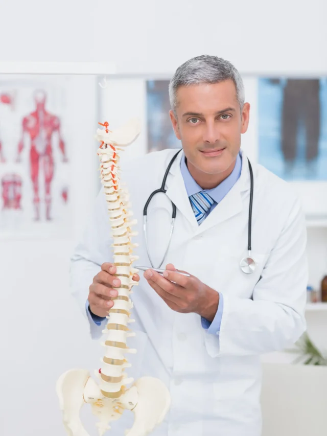 happy-doctor-showing-anatomical-spine